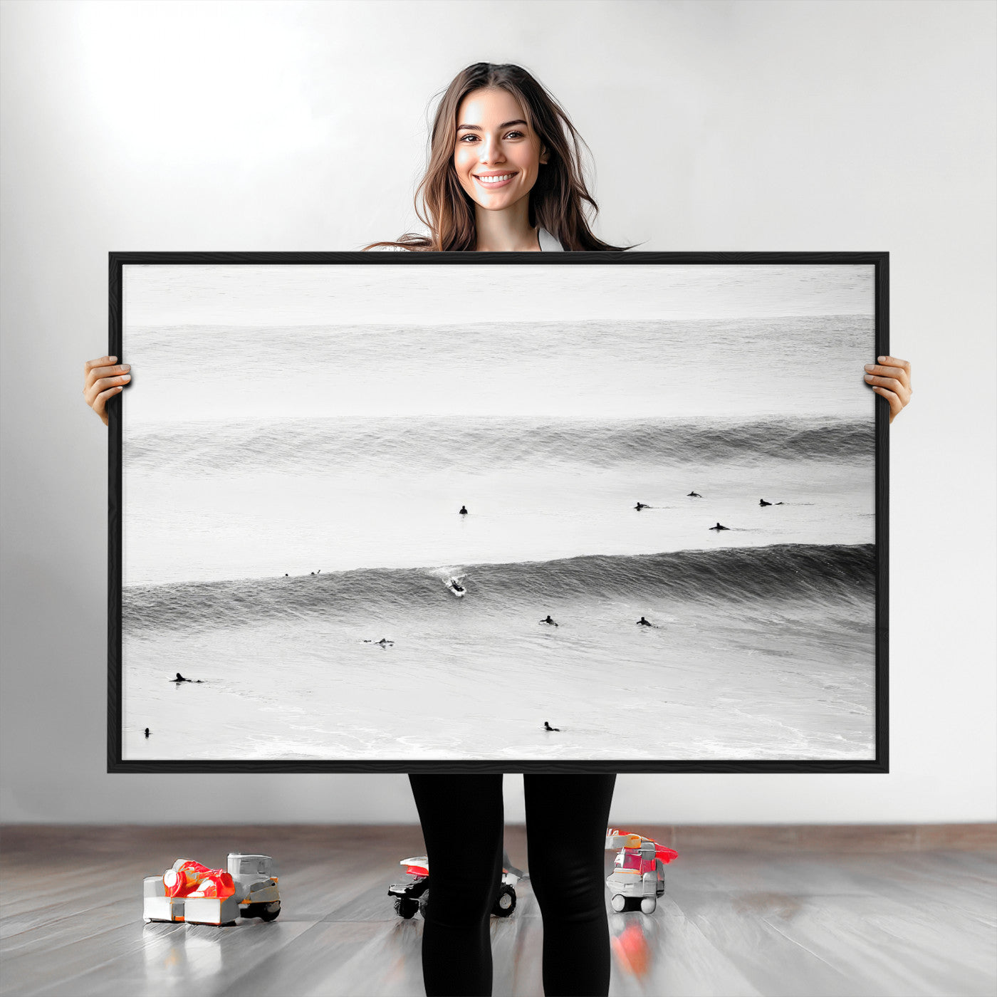 A monochrome photograph of swimmers gliding through gentle ocean waves, evoking a sense of calm and movement.