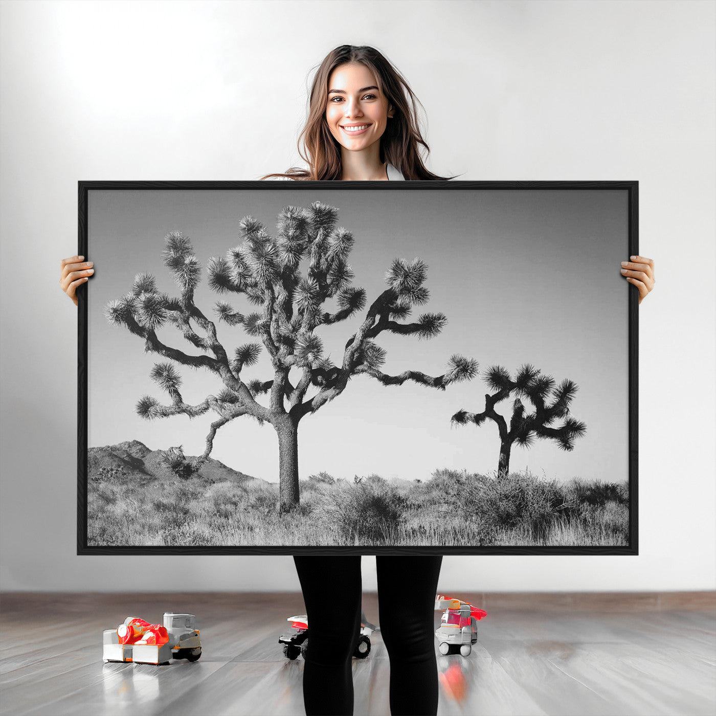 Black and white Joshua trees in a rugged desert landscape, creating a calm and minimalist feel for natural or rustic-themed interiors.