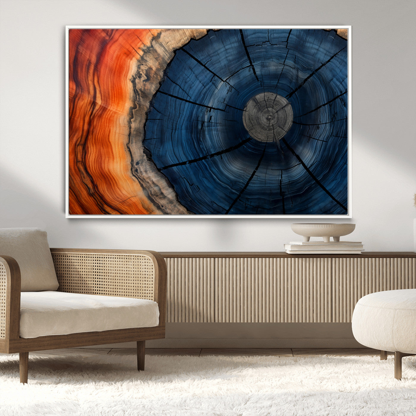 A captivating close-up of a tree trunk, showcasing its concentric rings in rich shades of blue, orange, and brown, highlighting the organic patterns of natural wood.
