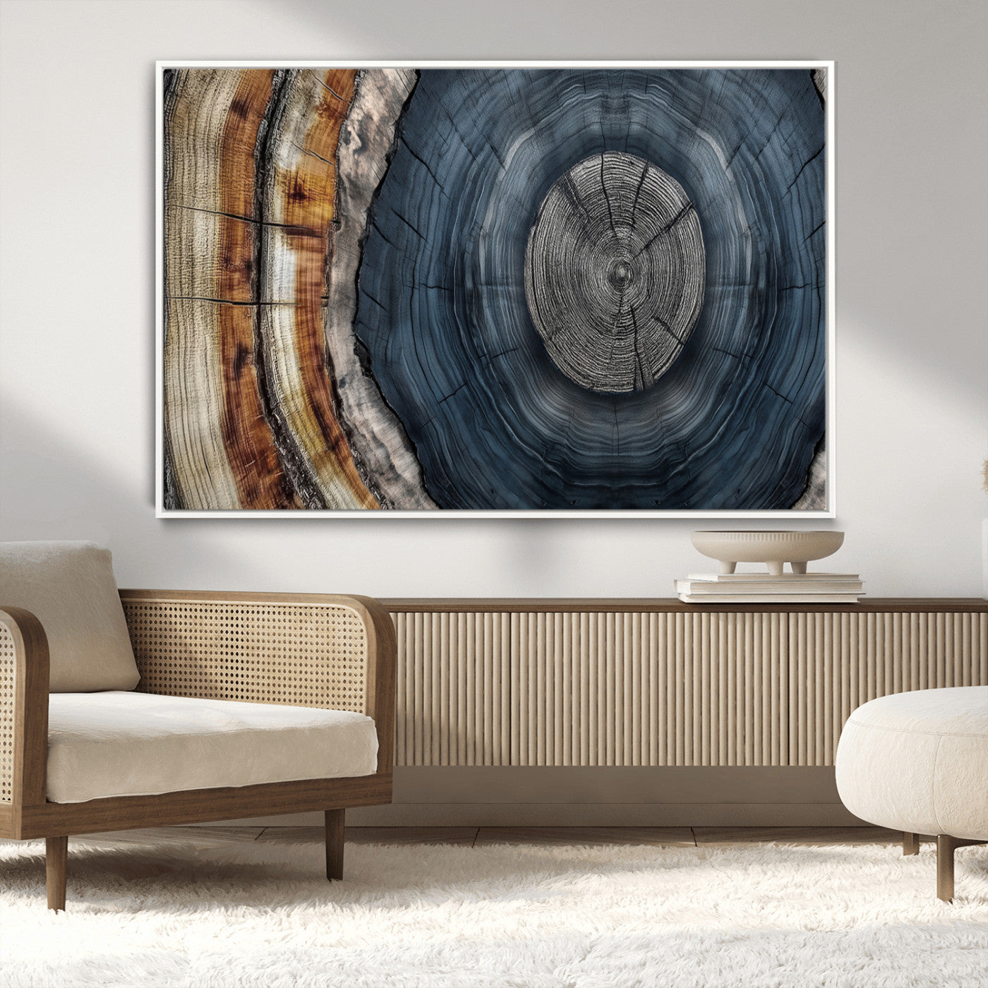 A stunning close-up of a tree trunk showing the intricate, circular growth rings, showcasing the natural textures and rich contrasts in deep blues, browns, and silvers.