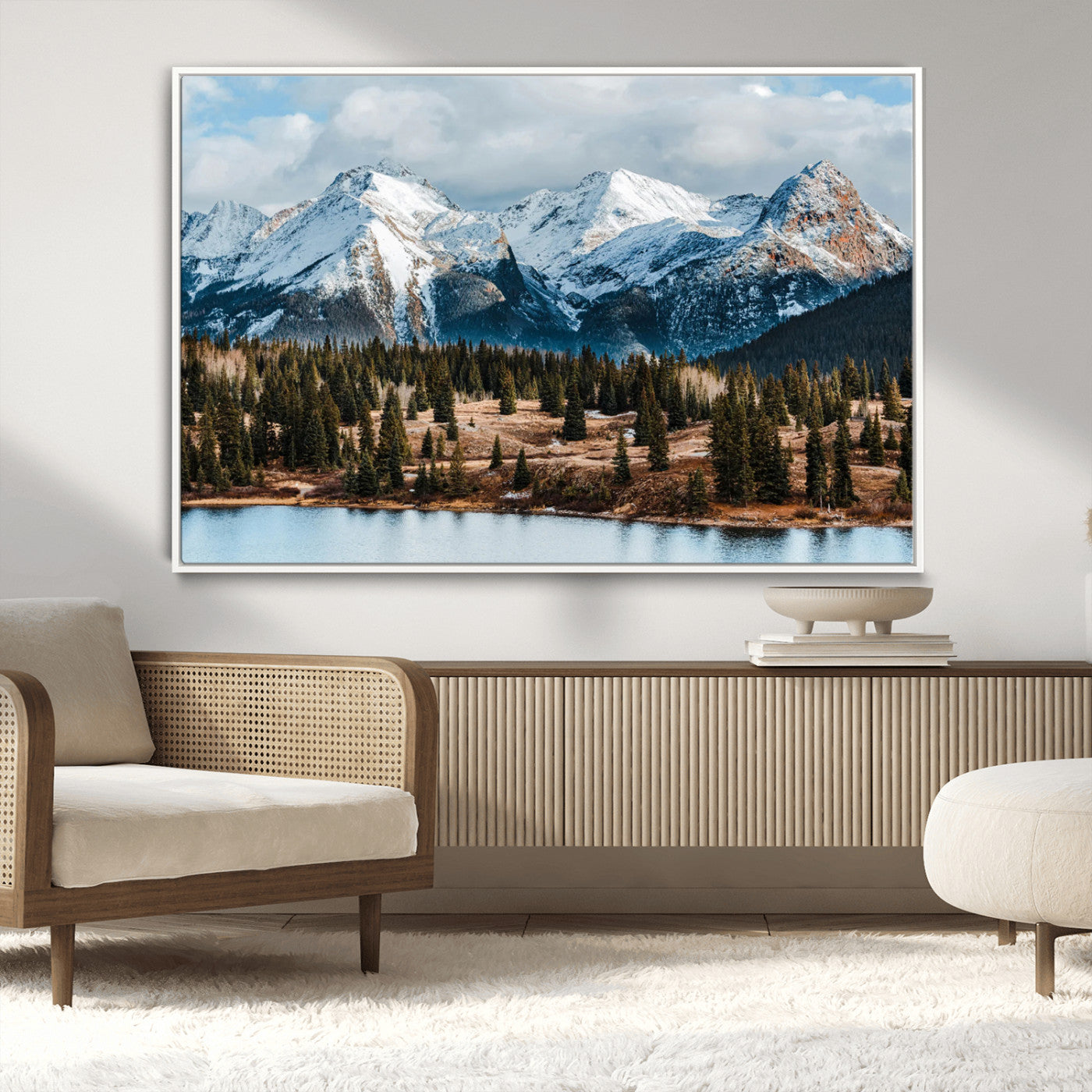 Framed canvas of snowy mountain peaks with pine forest and alpine lake, perfect for winter cabin or wilderness-inspired home decor.