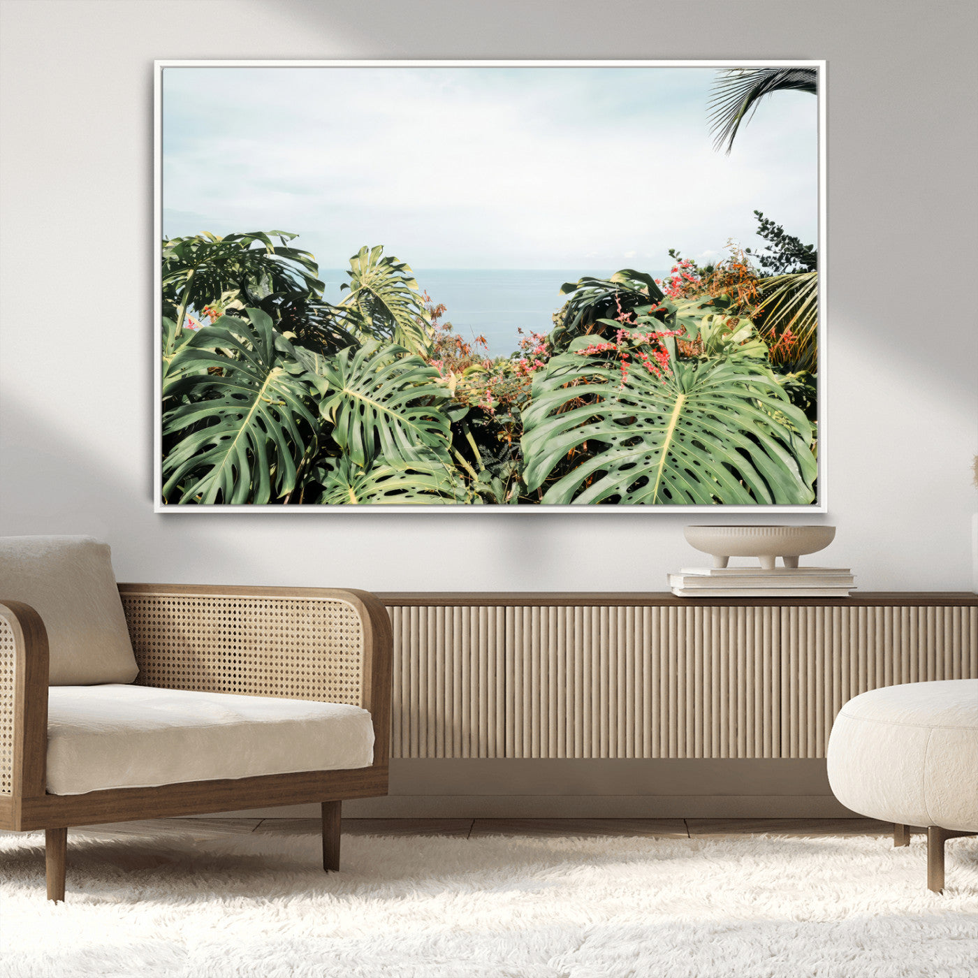 Monstera leaves and tropical flowers framing a calm ocean view, ideal for tropical coastal or exotic jungle-style interior wall decor.