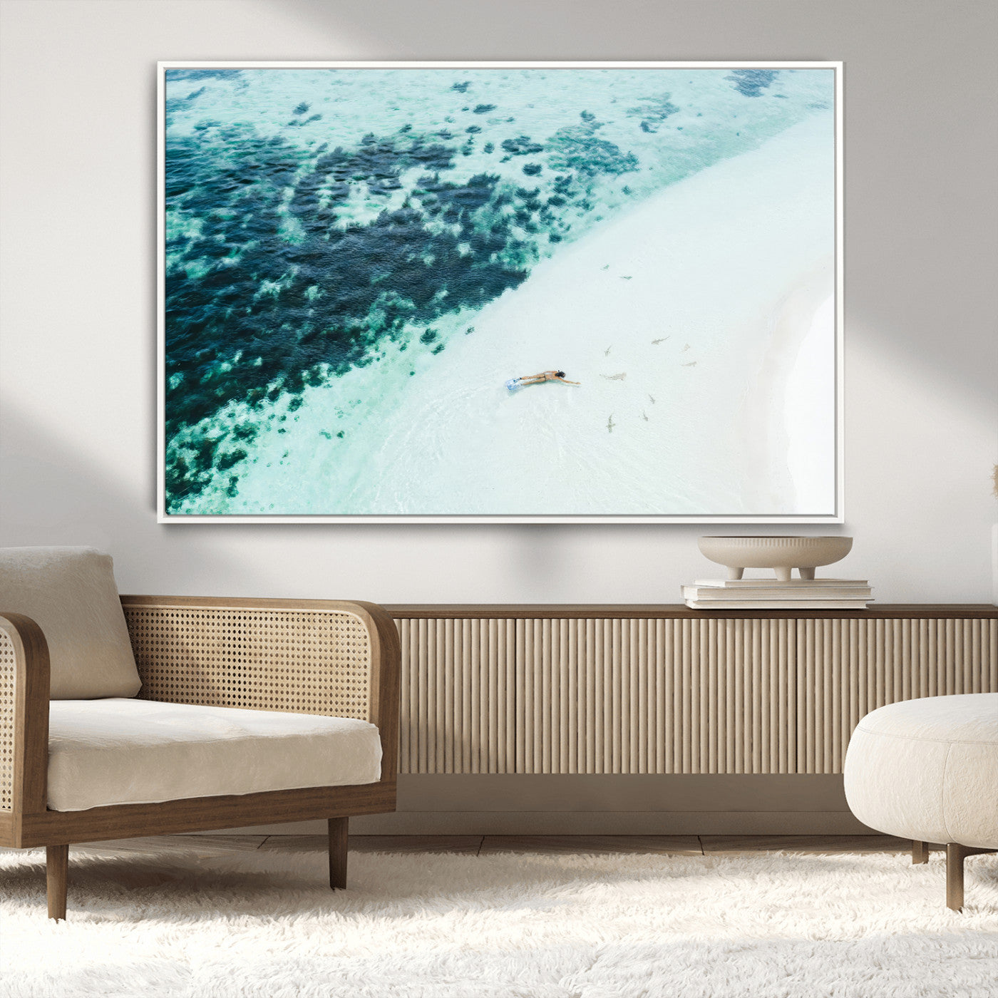 Canvas featuring an aerial view of a swimmer in shallow turquoise waters with coral patterns, ideal for tropical coastal home decor.