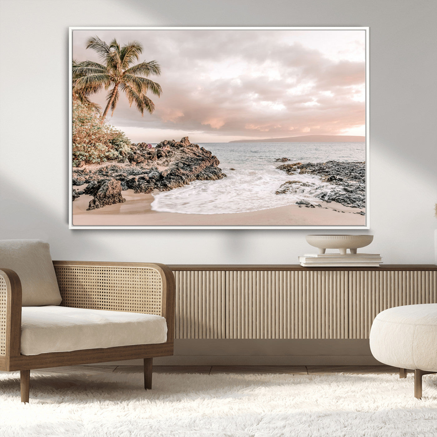 A peaceful beach scene with a palm tree and rocks, soft waves washing onto the shore under a soft pastel sky at sunset.