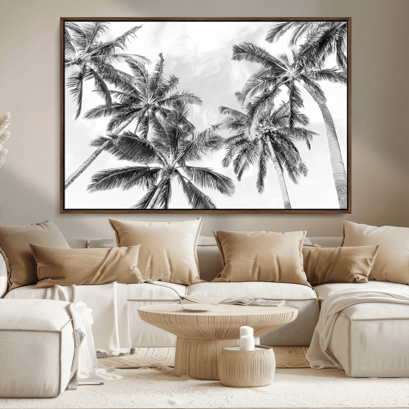 Black and white tropical palm trees viewed from below, swaying gently against a bright sky, creating a serene and elegant coastal atmosphere.