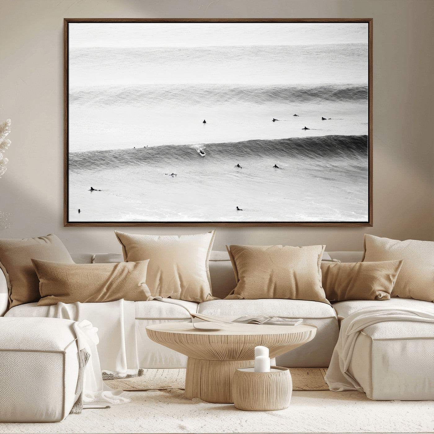 A monochrome photograph of swimmers gliding through gentle ocean waves, evoking a sense of calm and movement.