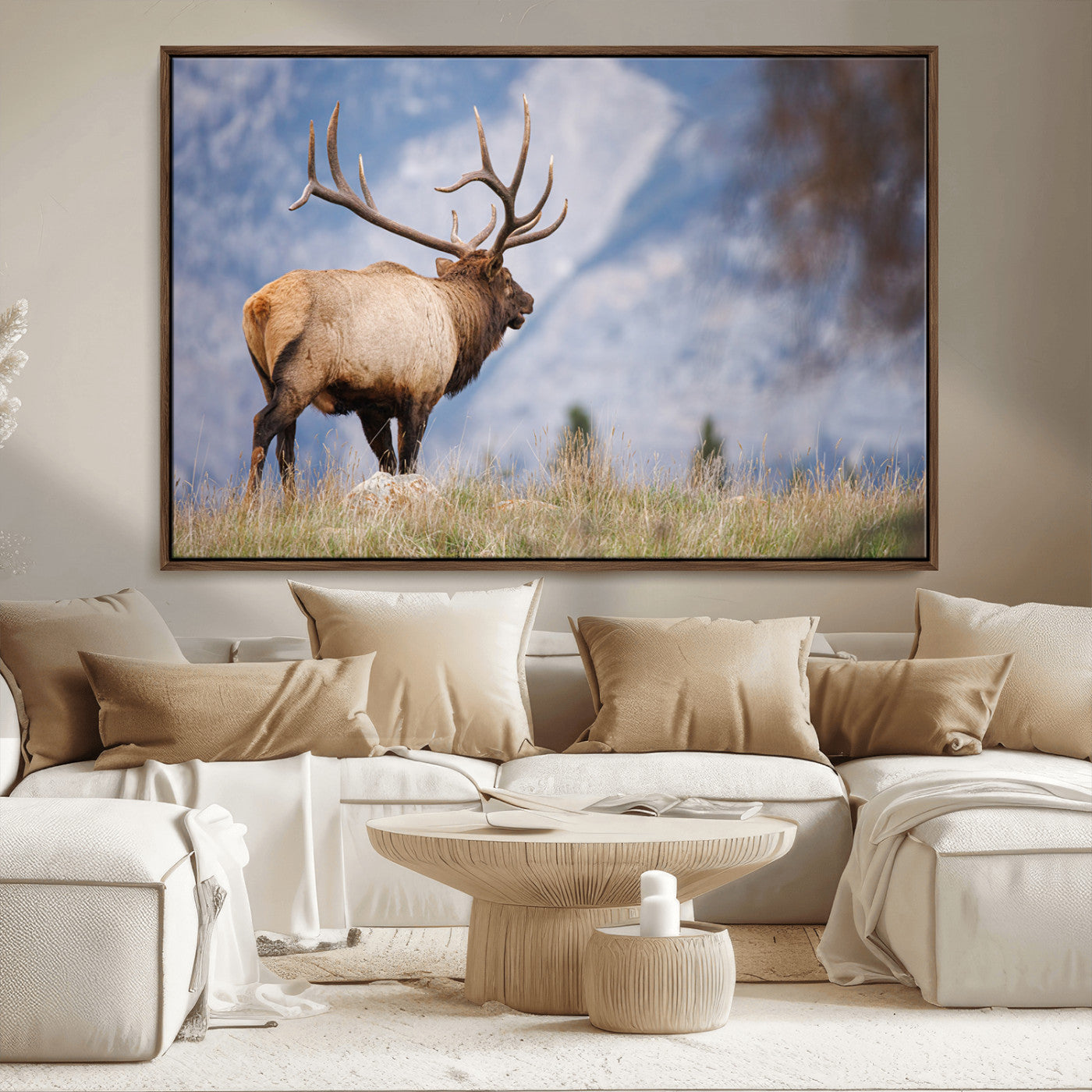 Elk with antlers standing on grass with mountain background, ideal for rustic, cabin, or lodge-inspired wall decor.