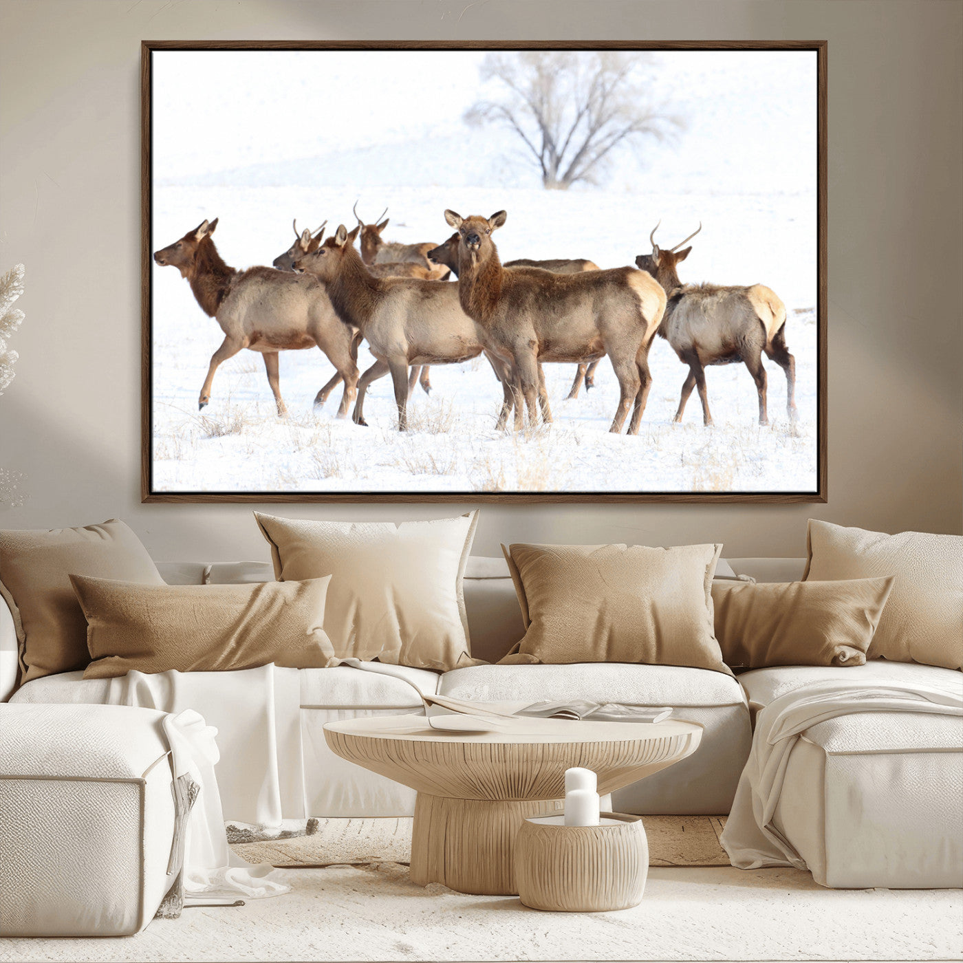 A group of elk standing on snowy terrain with a tree in the background, perfect for rustic or lodge-style winter wall decor.