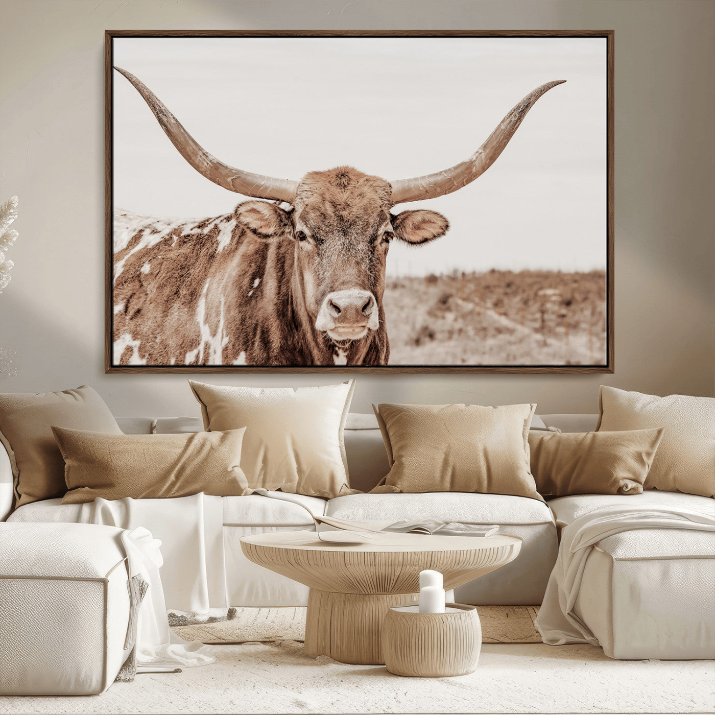 A longhorn cow in soft beige desert tones, standing calmly in open land, perfect for neutral western or rustic farmhouse interiors.