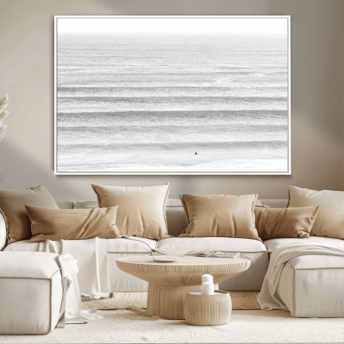 Monochrome photo of a lone surfer in calm layered waves, perfect for minimalist coastal or moody ocean-inspired wall decoration.