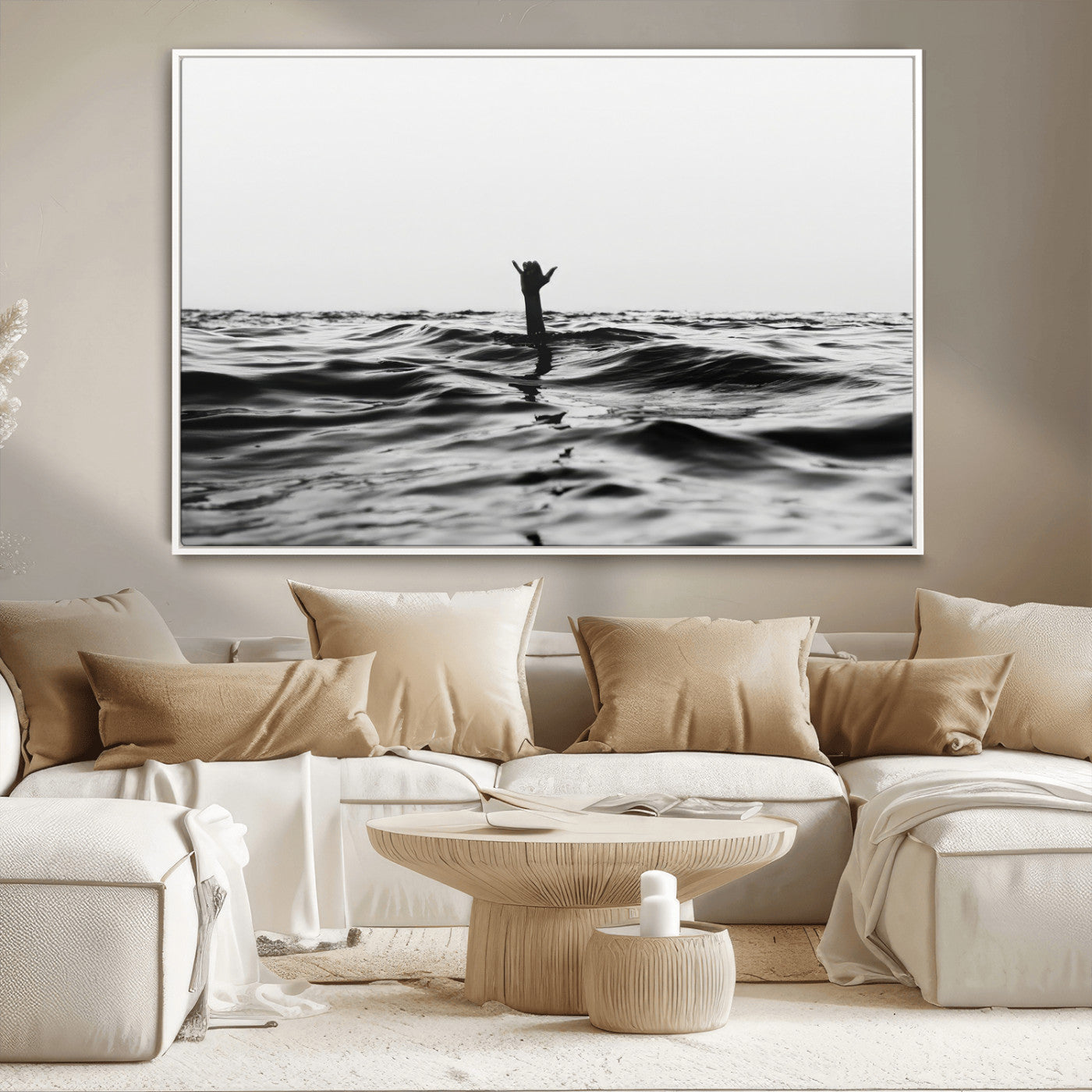 Black and white ocean with a hand making a surfer sign among dark waves, creating a dramatic and minimalist seascape with bold contrast.