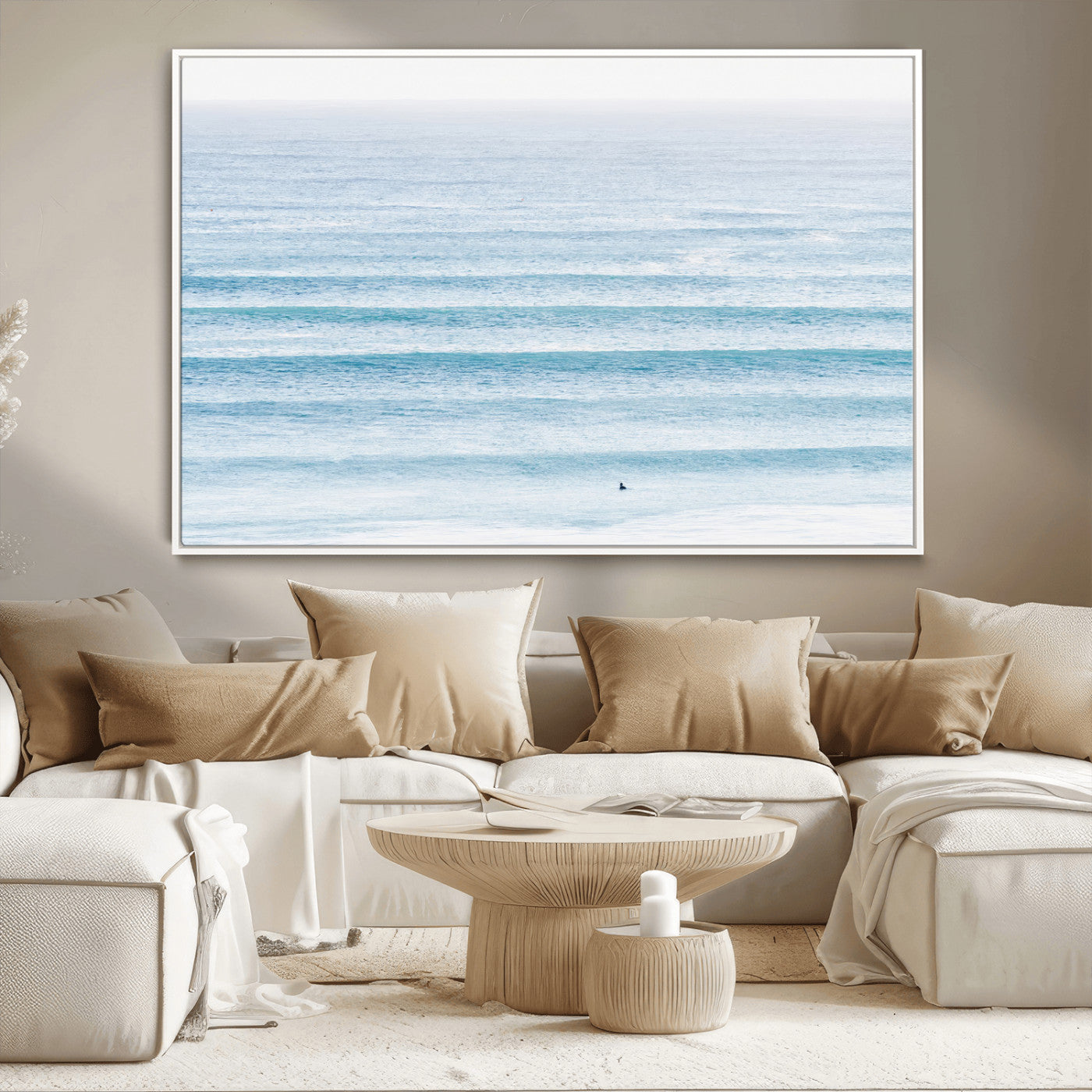 Minimalist ocean view with soft blue waves and a lone surfer, creating a serene and airy coastal aesthetic, perfect for tranquil home decor.