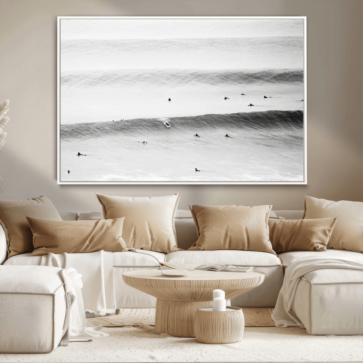 A monochrome photograph of swimmers gliding through gentle ocean waves, evoking a sense of calm and movement.