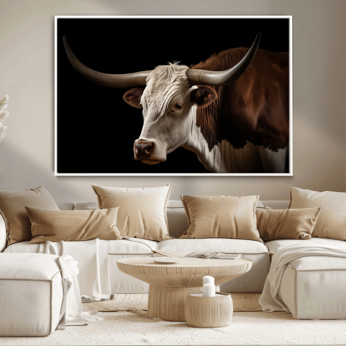 "Close-up of a brown and white longhorn cow with prominent curved horns against a black background."