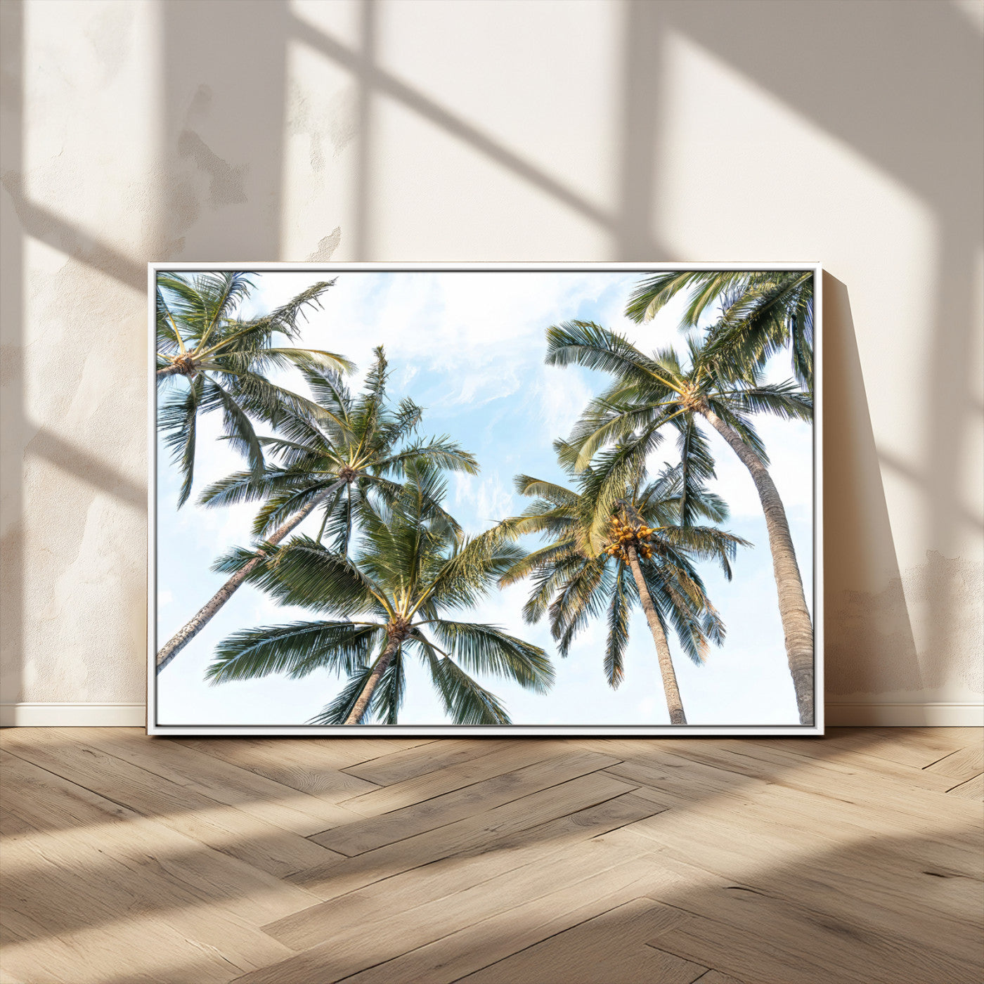 Framed canvas of tall palm trees reaching into a tropical sky, ideal for beach home or relaxed island-inspired wall decor.