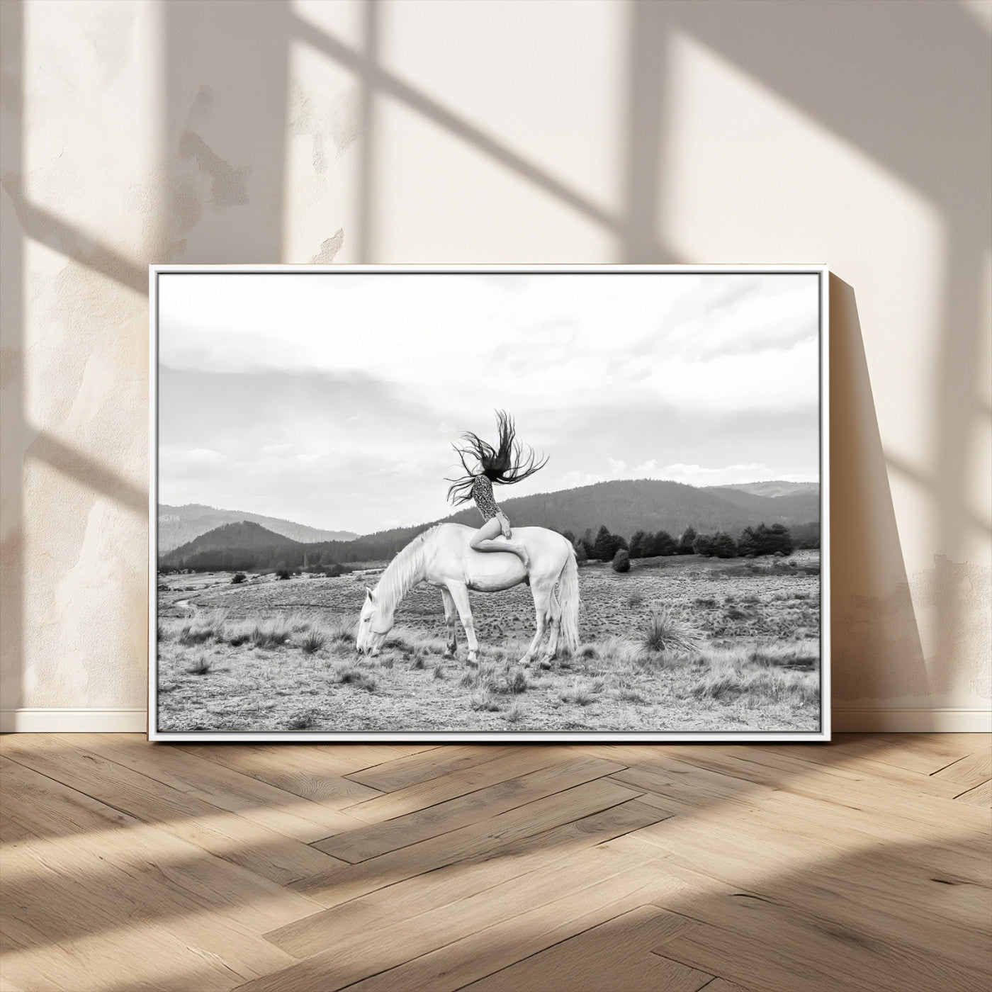 Black and white photo of a woman on a white horse in moody tones, ideal for Western Boho or modern rustic-style home decor.