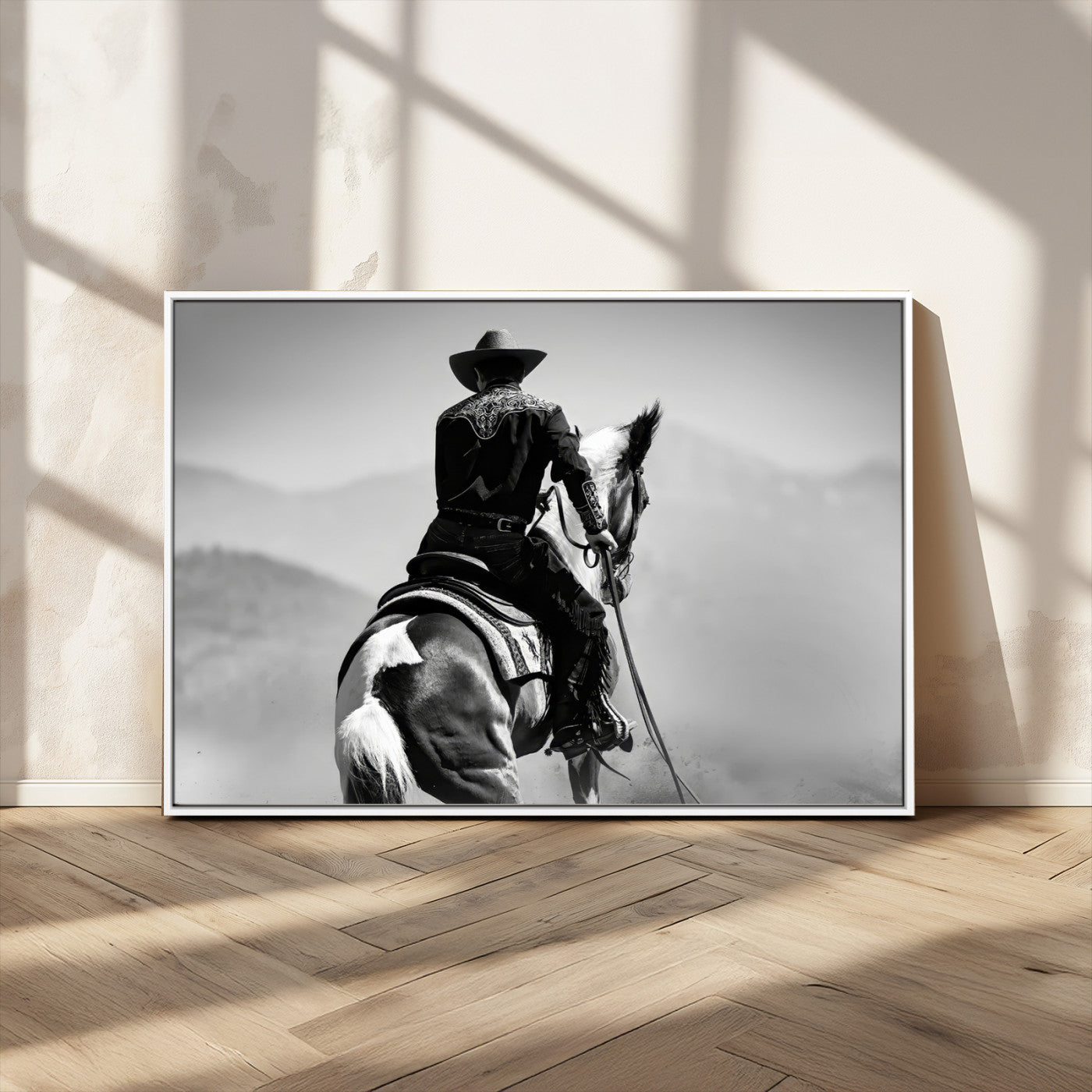 Black and white canvas of a cowboy on horseback with moody tones, perfect for rustic western or country-inspired home decor.
