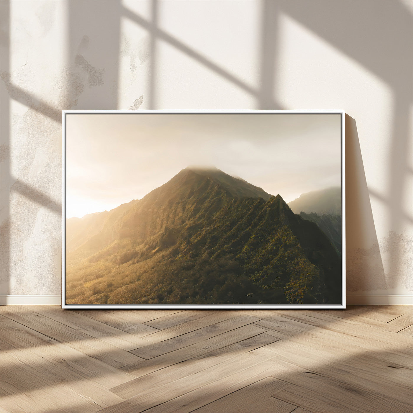 Sunlit mountain peak with mist rolling over its rugged slopes, bathed in golden light, creating a warm and tranquil nature-inspired scene.
