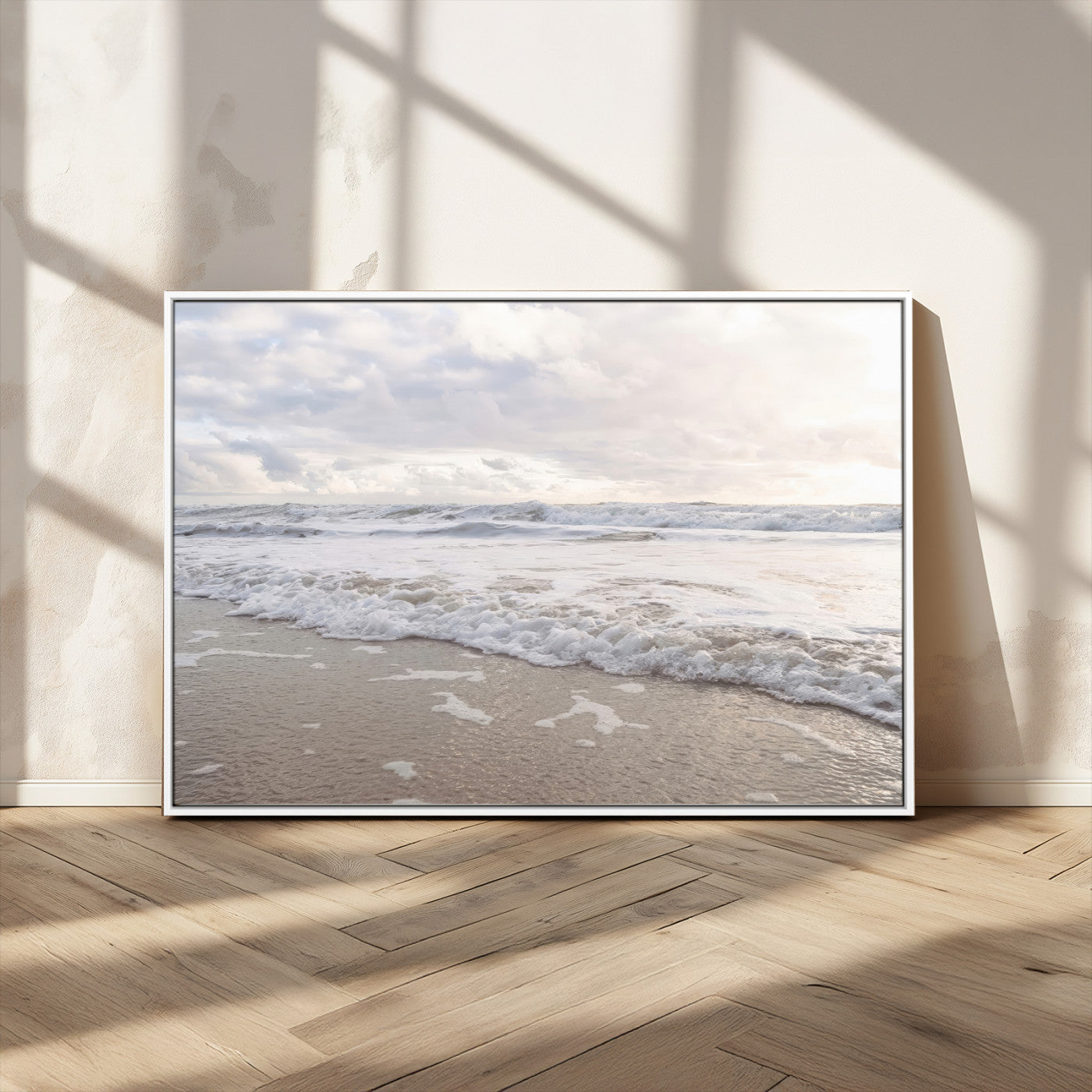 Peaceful ocean waves rolling onto the sandy shore under soft light, perfect for neutral or coastal minimalist decor themes.