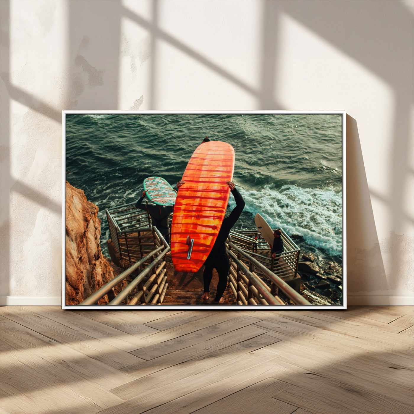 A surfer carrying a bold orange surfboard down a rugged staircase toward the ocean, bathed in golden hour light, capturing the energy of coastal adventure.