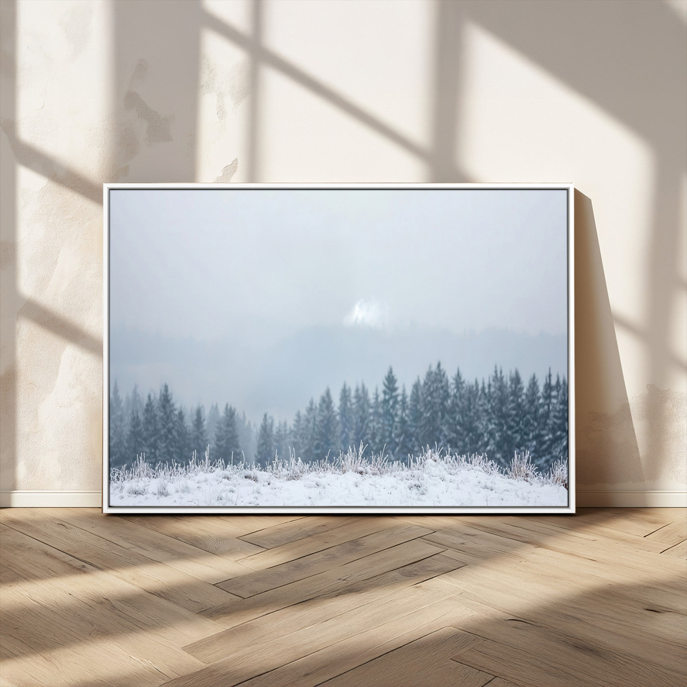 Snow-covered forest under misty sky, soft light breaking through clouds, ideal for minimalist or Nordic-inspired home decor.