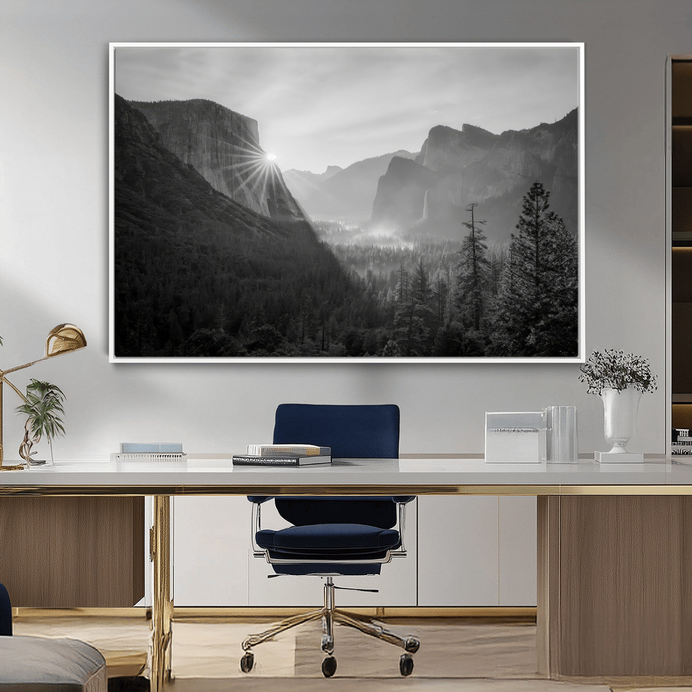 Black and white landscape of Yosemite with sun rays peeking over El Capitan, ideal for moody nature or modern rustic decor.