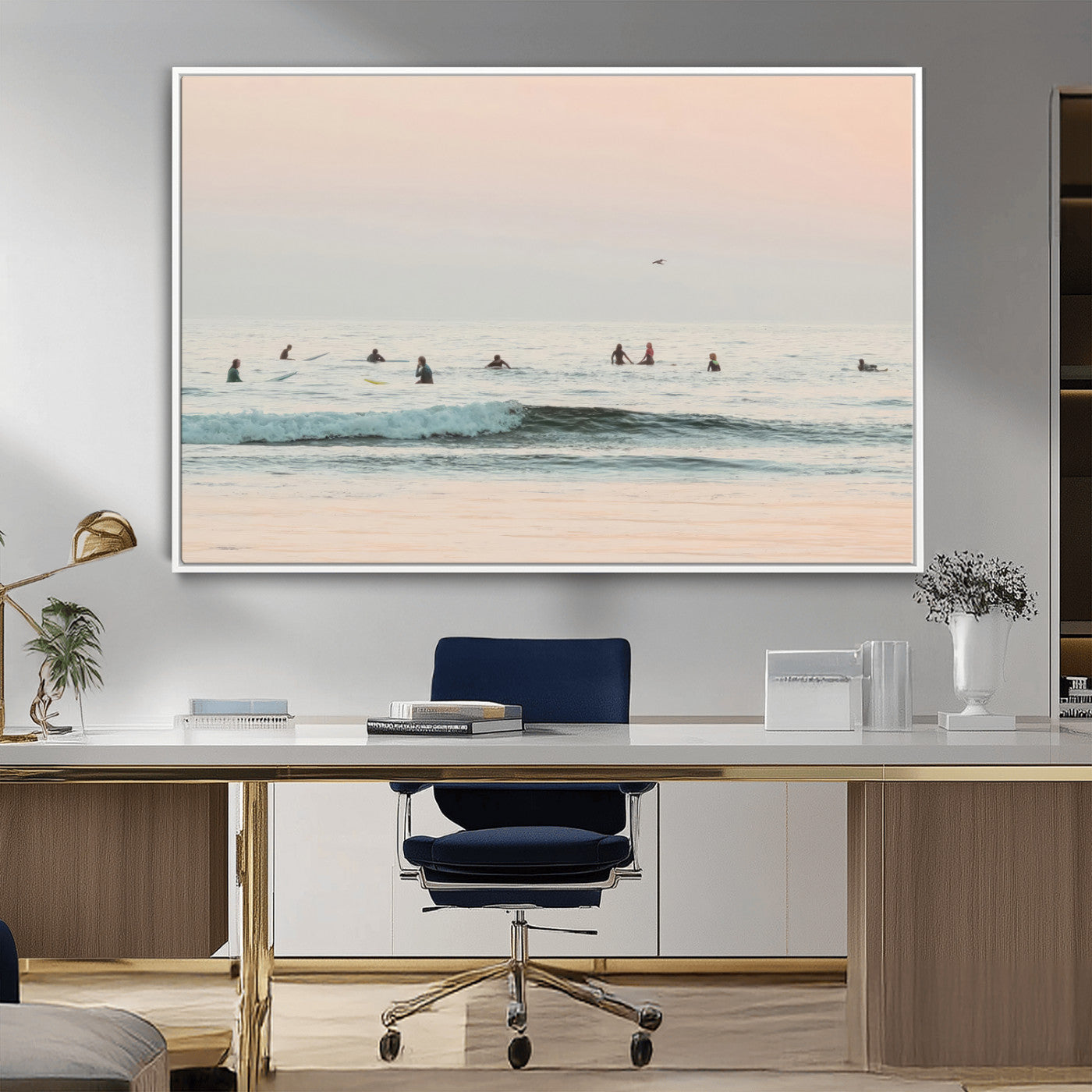 Dreamy photo of surfers waiting on soft pastel waves under a pink sunset sky, ideal for soft coastal minimalist or serene ocean-themed home decor.