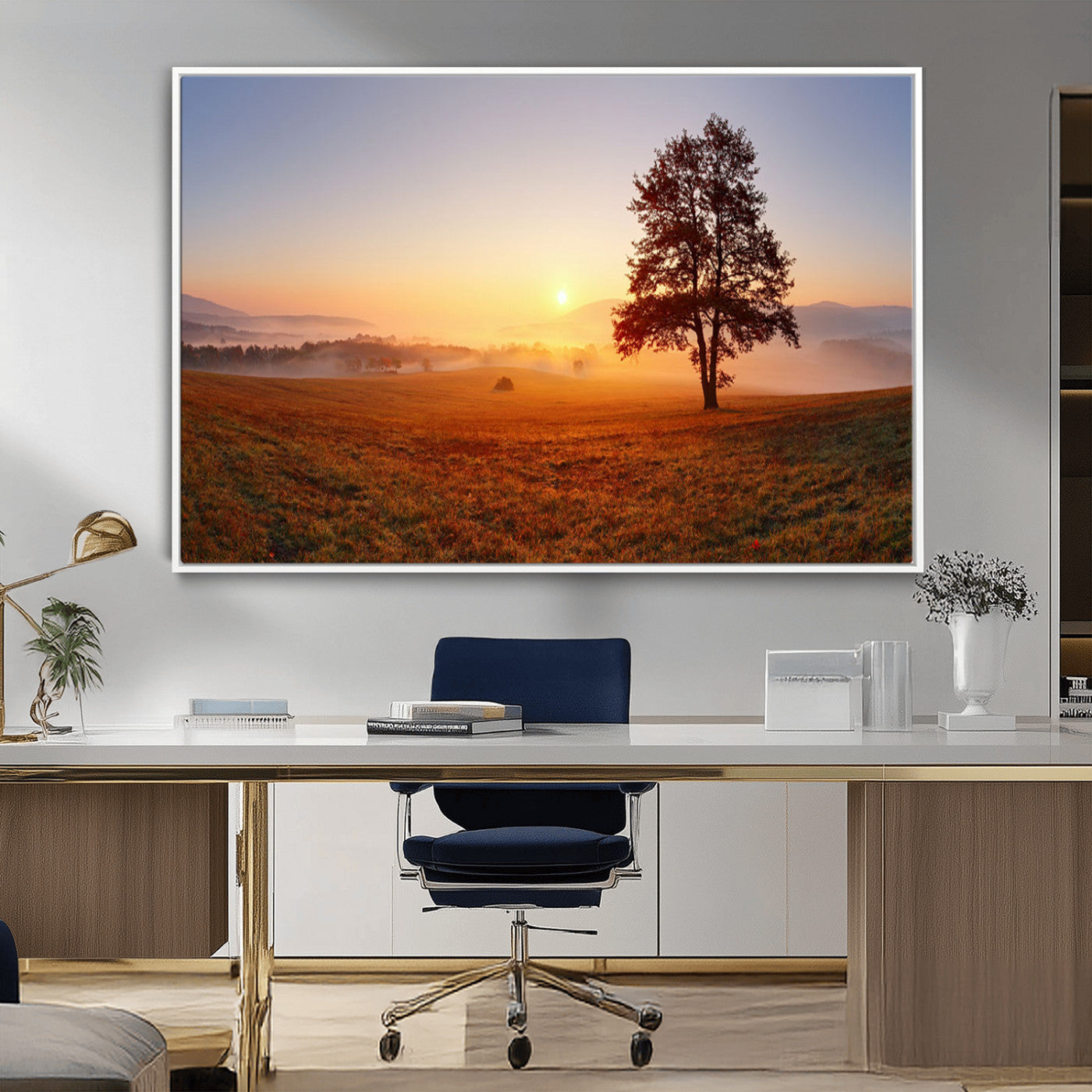 A tranquil landscape at sunrise with a mist-covered field and a lone tree, creating a peaceful and natural atmosphere.