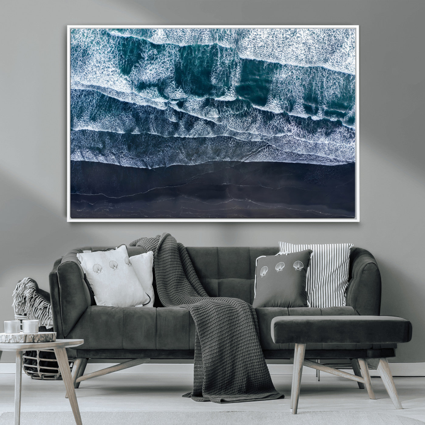 Canvas of aerial ocean waves crashing onto a black sand beach in moody tones, ideal for modern coastal or minimalist home decor.