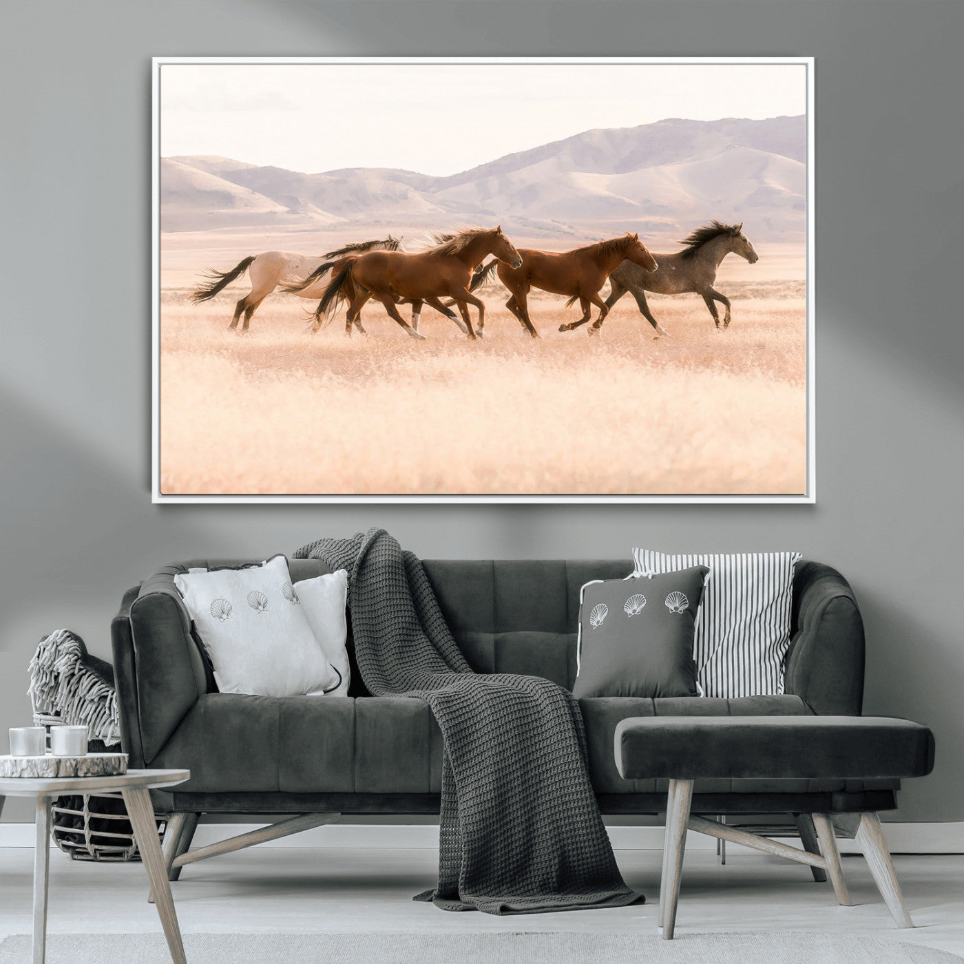 A herd of wild horses galloping through a sunlit desert plain with mountains in the background, perfect for rustic or western-themed wall decor.