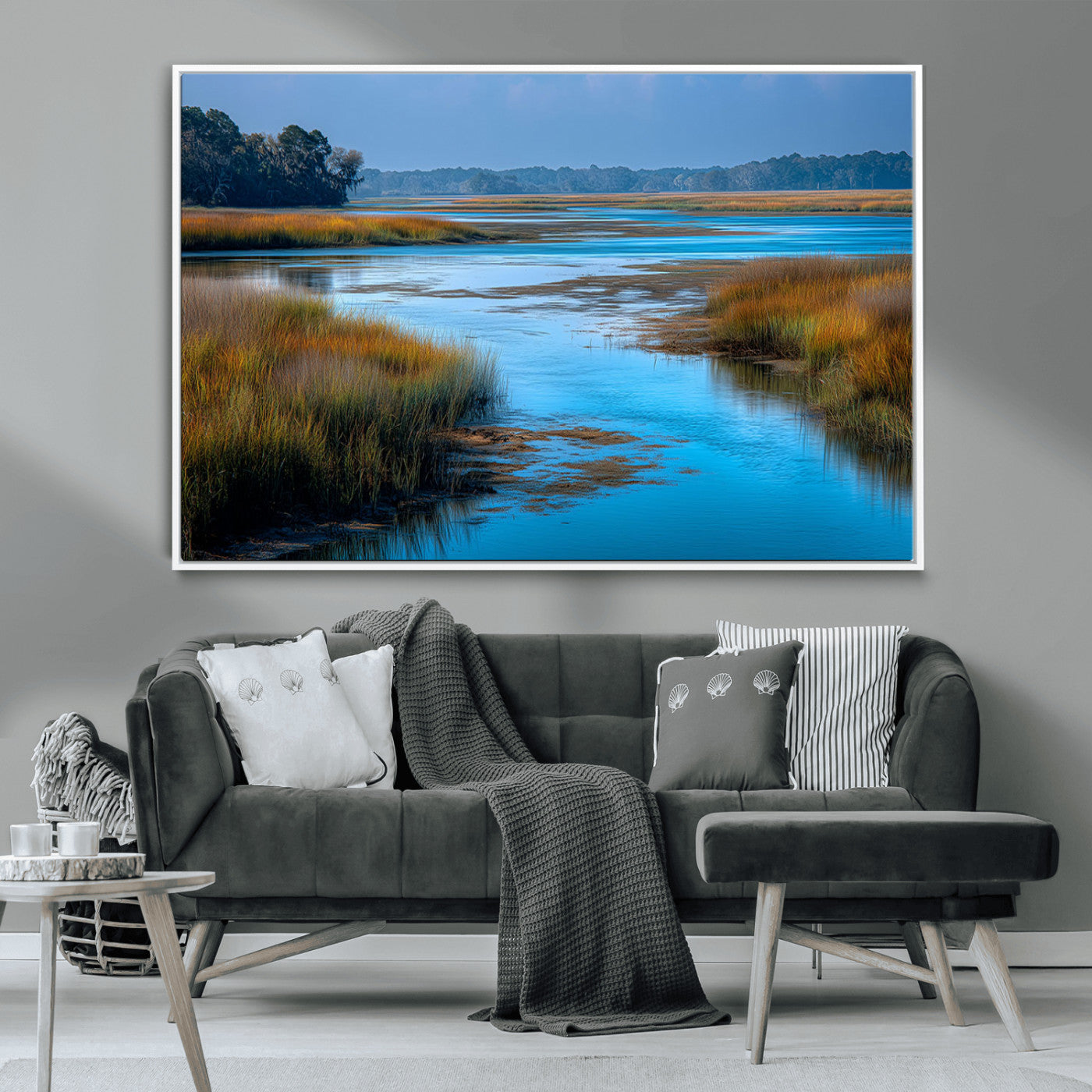 A peaceful marshland scene with calm blue water reflecting the surrounding grasses and trees, capturing the beauty of nature in a serene landscape.