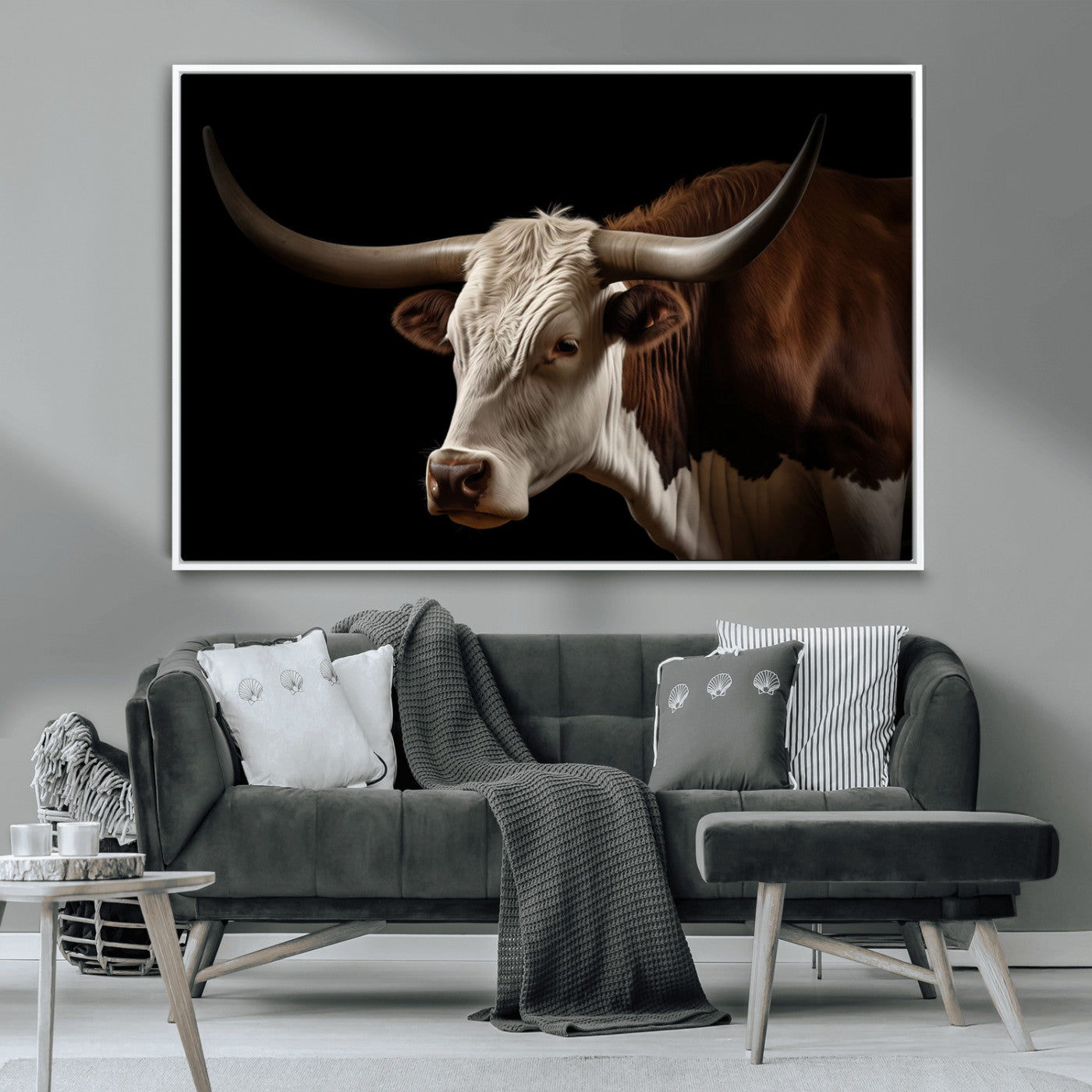 "Close-up of a brown and white longhorn cow with prominent curved horns against a black background."