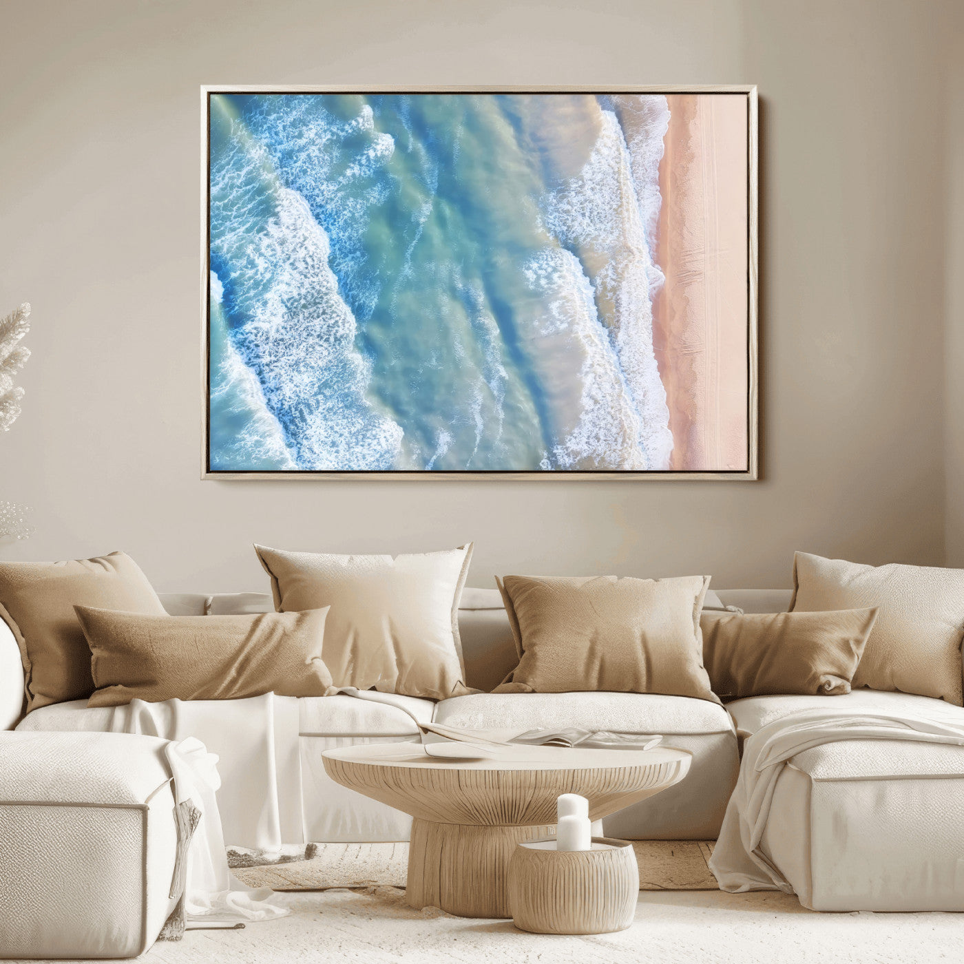 Aerial photo of soft blue waves meeting sandy shore, perfect for modern coastal or beach-themed decor with a light and tranquil aesthetic.