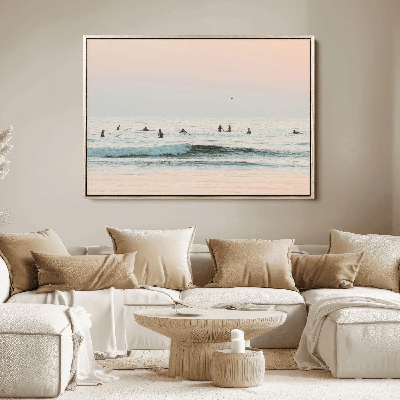 Dreamy photo of surfers waiting on soft pastel waves under a pink sunset sky, ideal for soft coastal minimalist or serene ocean-themed home decor.