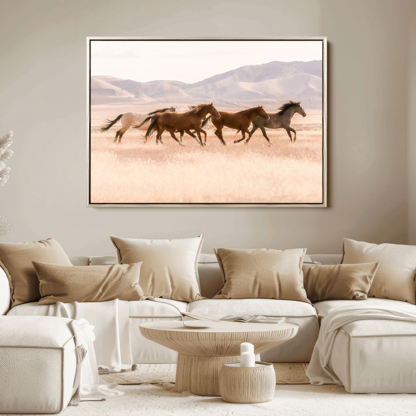 A herd of wild horses galloping through a sunlit desert plain with mountains in the background, perfect for rustic or western-themed wall decor.