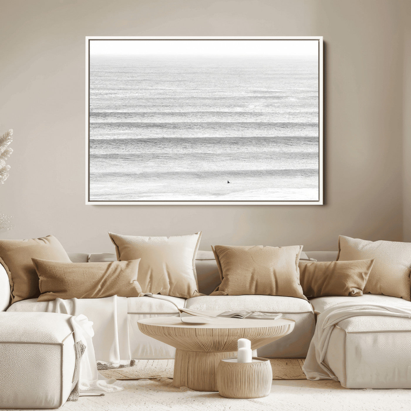 Monochrome photo of a lone surfer in calm layered waves, perfect for minimalist coastal or moody ocean-inspired wall decoration.