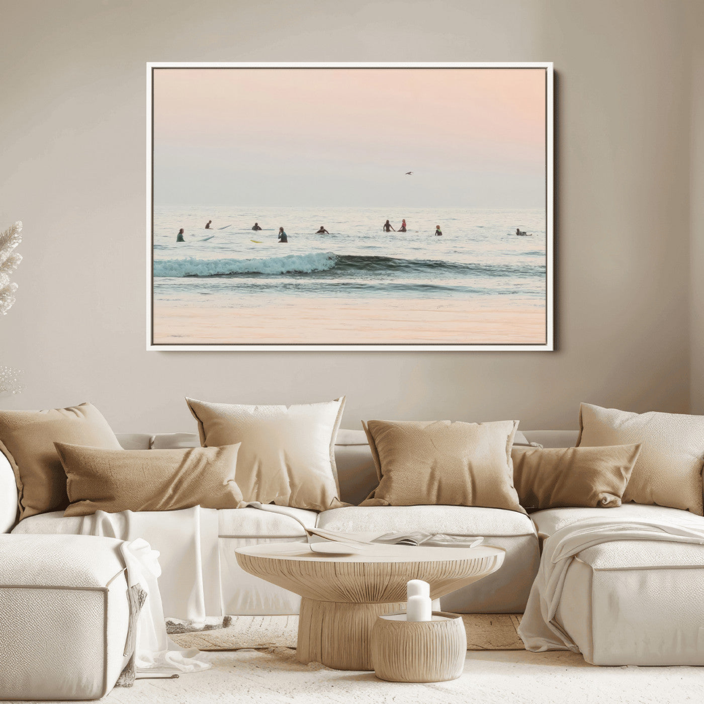 Dreamy photo of surfers waiting on soft pastel waves under a pink sunset sky, ideal for soft coastal minimalist or serene ocean-themed home decor.