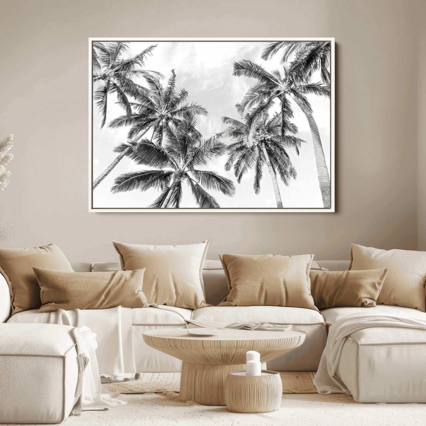 Black and white tropical palm trees viewed from below, swaying gently against a bright sky, creating a serene and elegant coastal atmosphere.