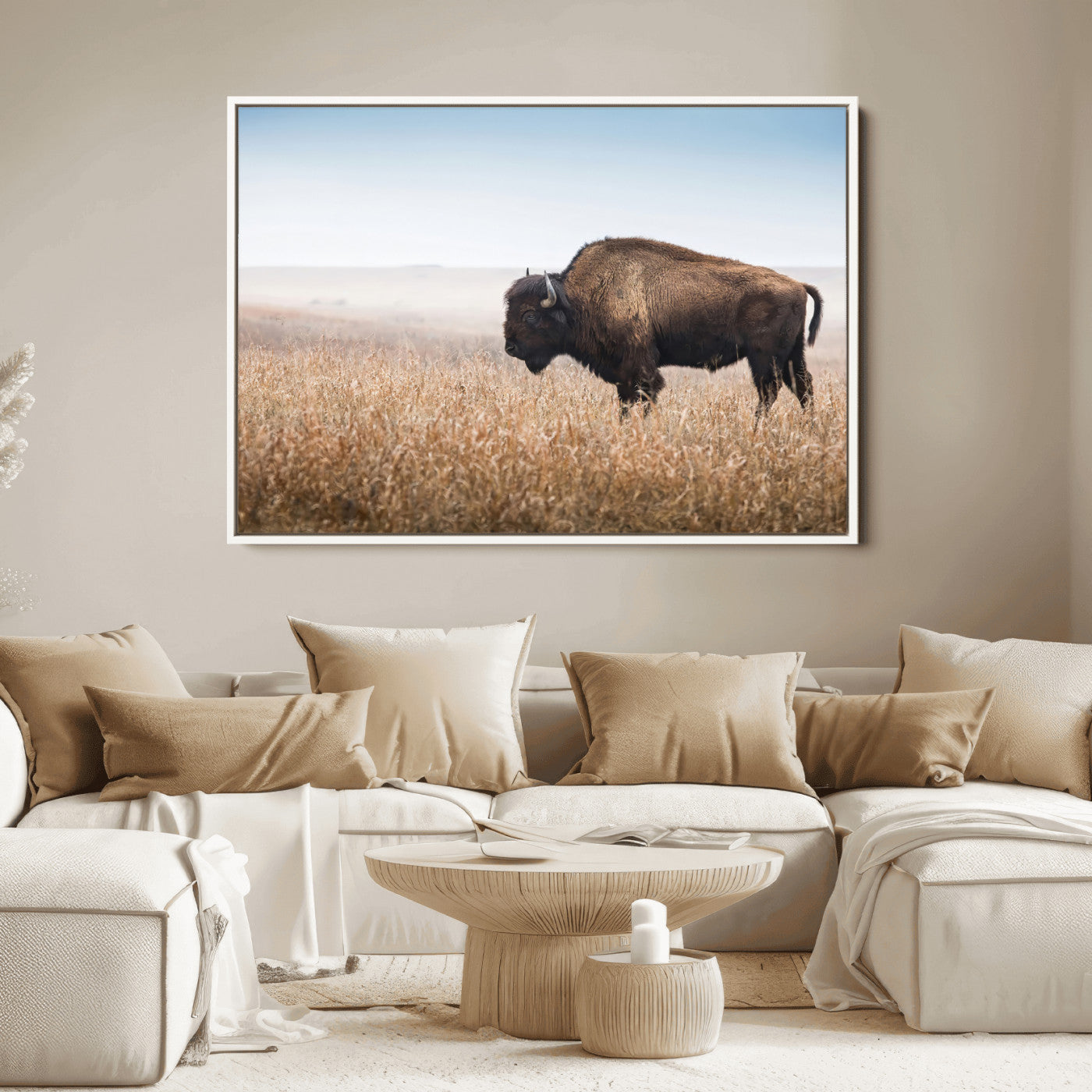 A majestic bison standing in an open prairie field, its strong form blending into the golden grass under a vast blue sky, evoking the wild spirit of the American plains.
