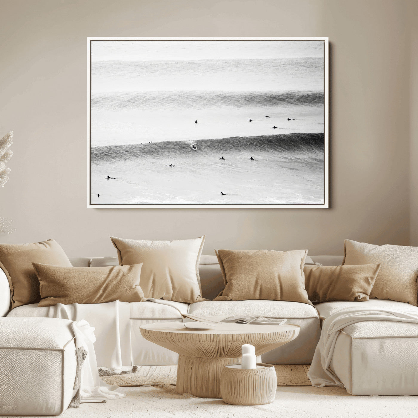 A monochrome photograph of swimmers gliding through gentle ocean waves, evoking a sense of calm and movement.