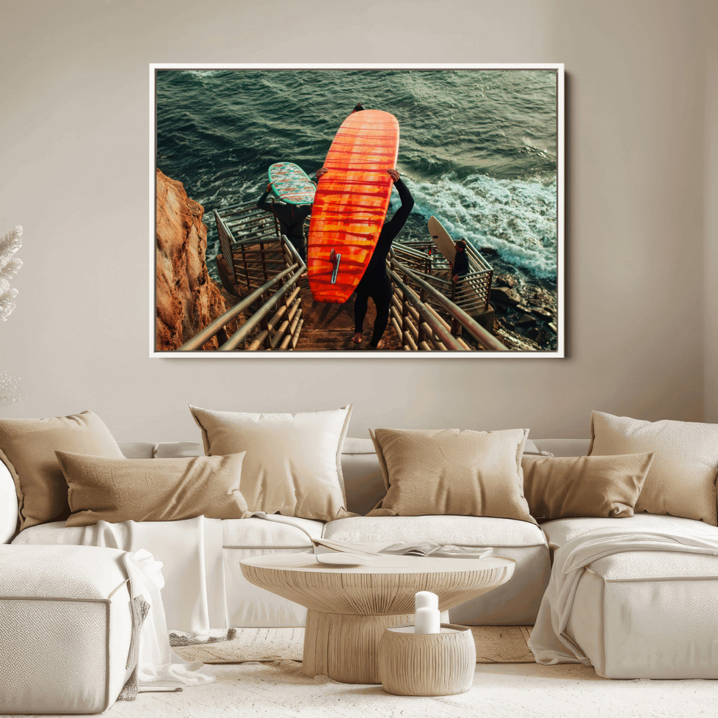 A surfer carrying a bold orange surfboard down a rugged staircase toward the ocean, bathed in golden hour light, capturing the energy of coastal adventure.