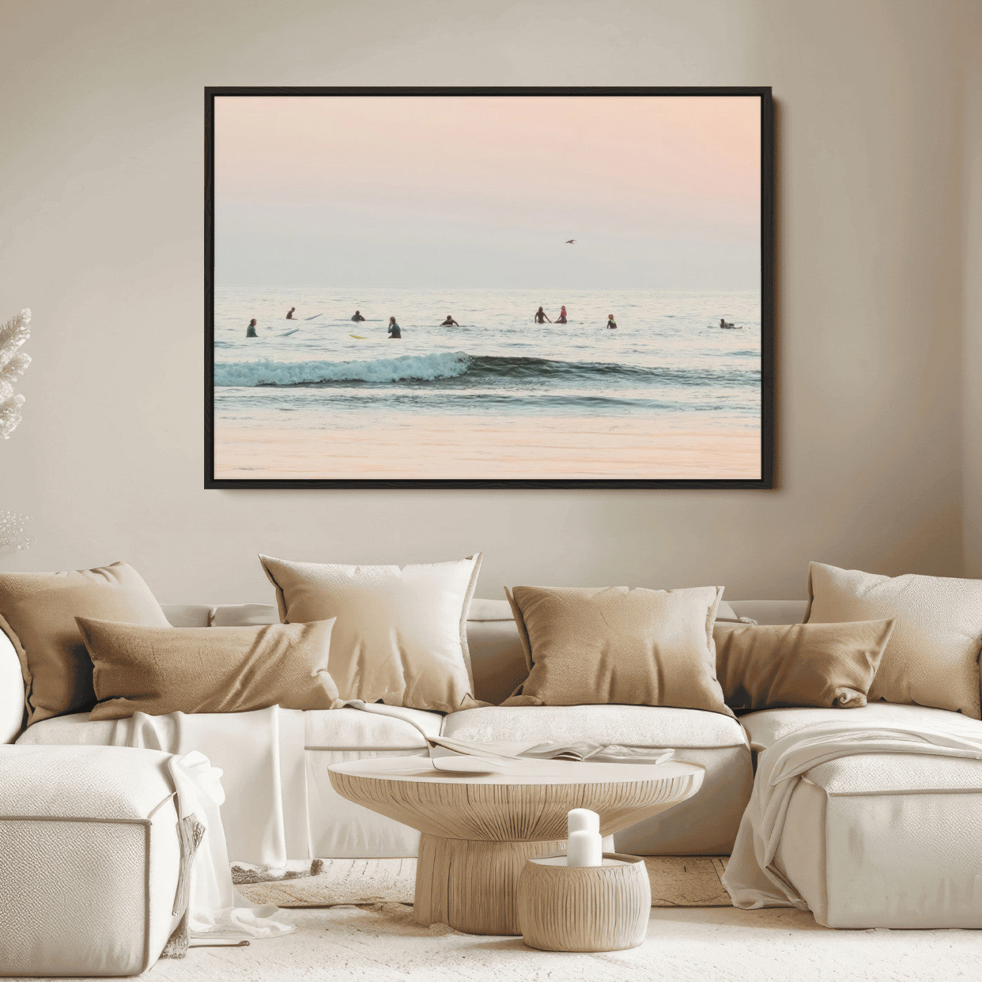 Dreamy photo of surfers waiting on soft pastel waves under a pink sunset sky, ideal for soft coastal minimalist or serene ocean-themed home decor.