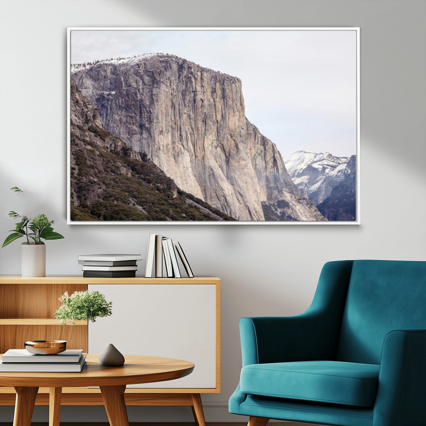 Framed canvas of El Capitan’s vertical granite face in Yosemite with snowy peaks, ideal for Sierra minimalism or mountain-inspired decor.