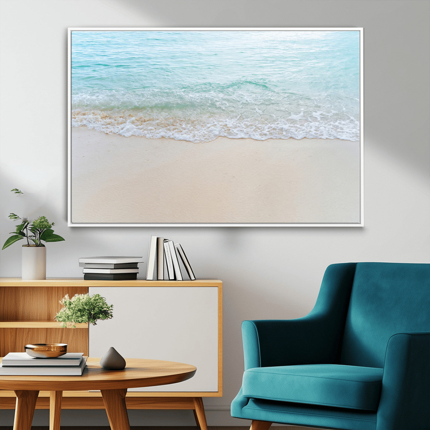 Soft shoreline with gentle aqua waves on smooth sand, ideal for minimalist coastal or pastel ocean-inspired home wall decor.