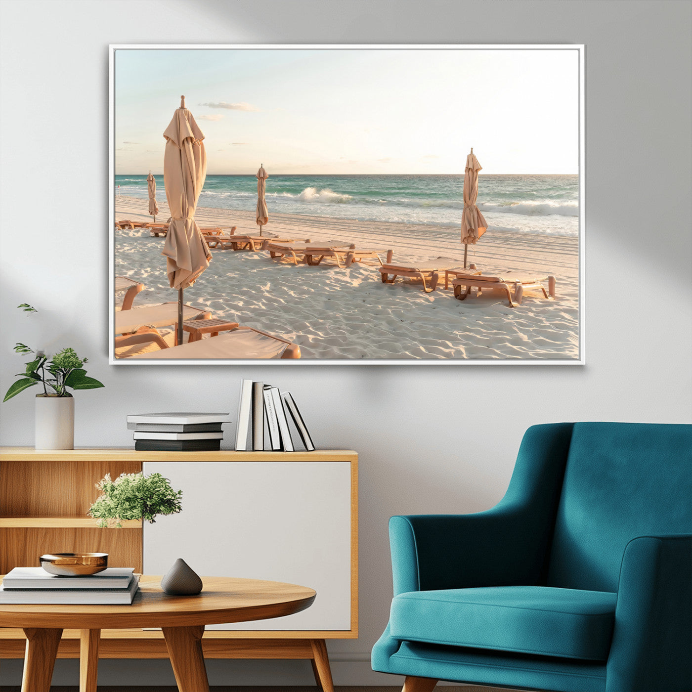 Minimalist photo of empty beach loungers and umbrellas on soft sand, ideal for calm seaside or pastel coastal-style home decor.