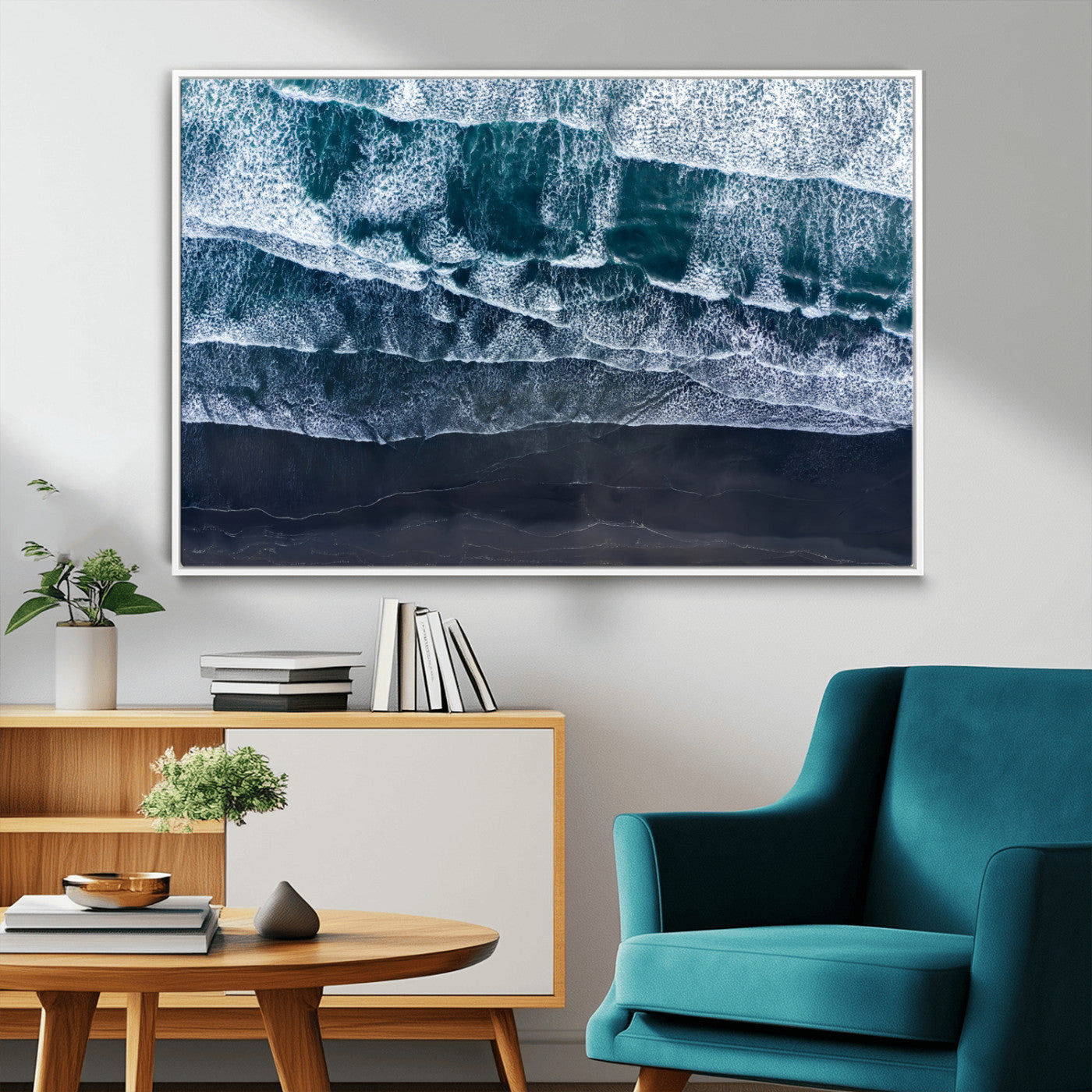 Canvas of aerial ocean waves crashing onto a black sand beach in moody tones, ideal for modern coastal or minimalist home decor.