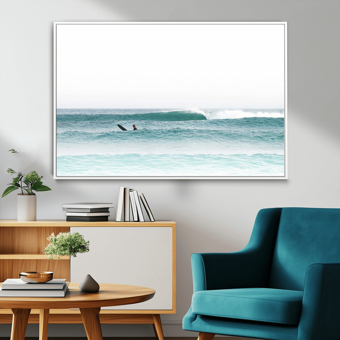 Minimalist photo of a lone surfer on calm aqua waves under bright sky, perfect for Scandinavian coastal or serene ocean-inspired home decor.