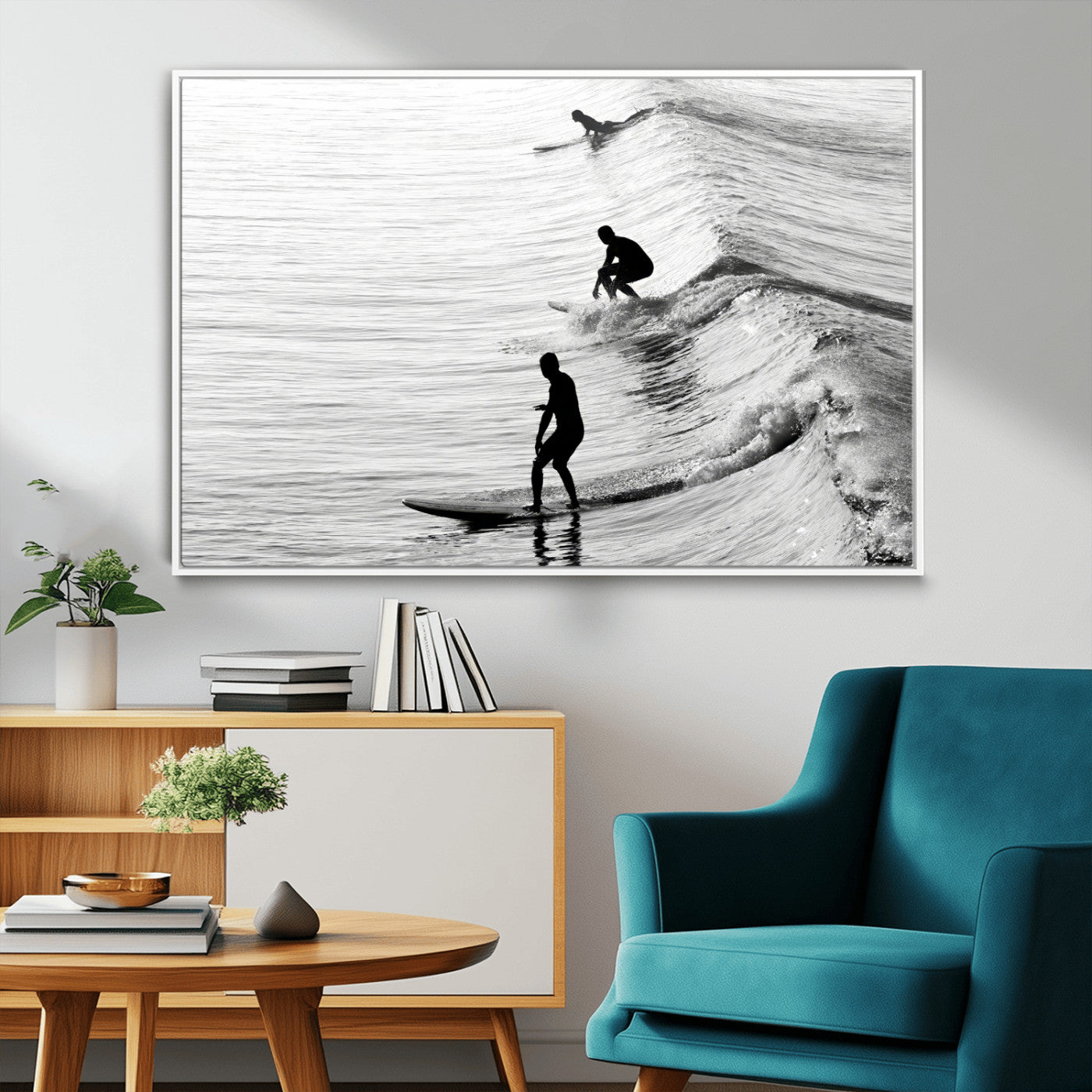 Black and white photo of surfers riding waves in a moody, high-contrast scene, ideal for modern coastal or surf-inspired home decor.