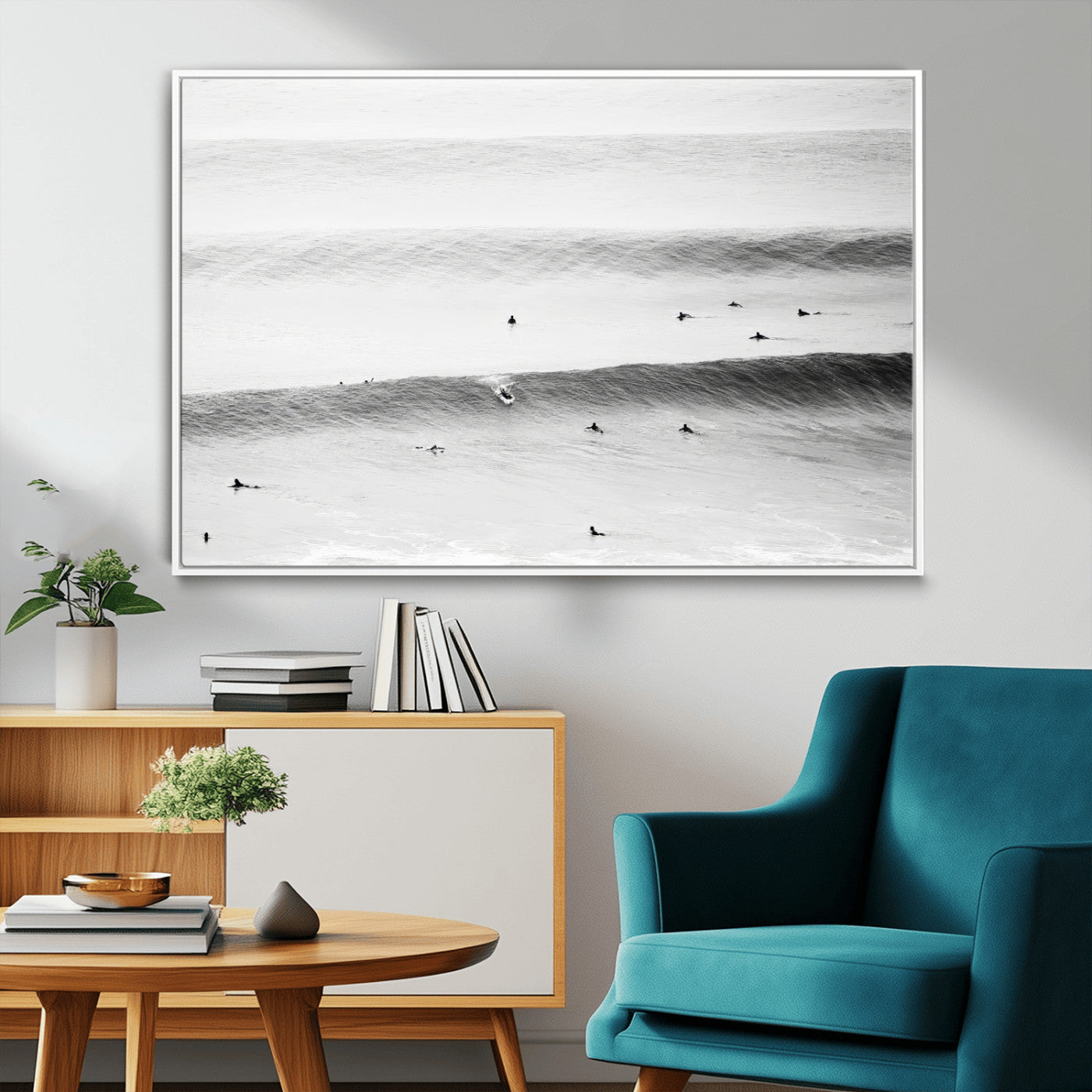 A monochrome photograph of swimmers gliding through gentle ocean waves, evoking a sense of calm and movement.