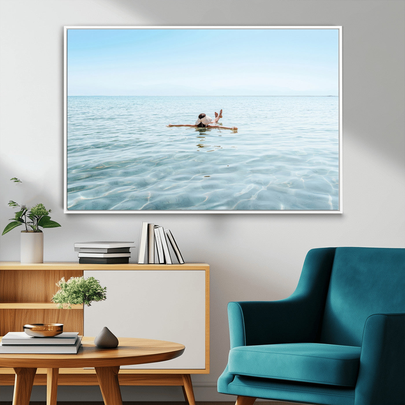 A peaceful minimalist scene of a person floating on crystal-clear water, surrounded by a vast open horizon, capturing relaxation and serenity in a tranquil aquatic setting.